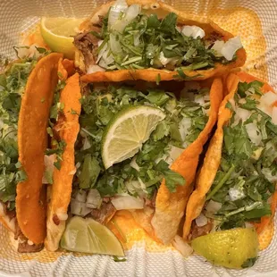 Quesa birria crunchy tacos dressed with onions, cilantro, lime, and salsa- so yummy!