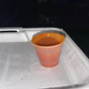 This was the teeny buffalo sauce container they expected you to use on all the chicken. I managed to cover one wing and less then a half.