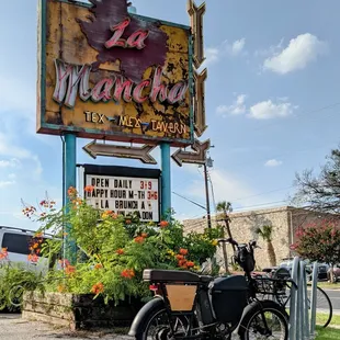 a motorcycle parked in front of a restaurant