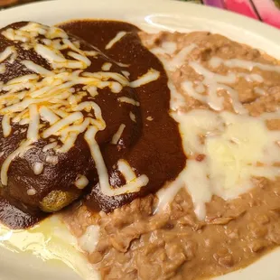 Chili Relleno with a Mole and Salsa sauce. Excellent!! Very mild Mole flavor with a side of beans. Taco &amp; guasalad.