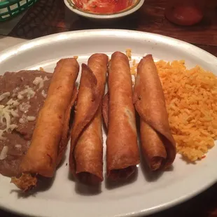 a plate of mexican food with rice and beans