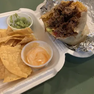Barbacoa burrito with chips still warm from the oven!