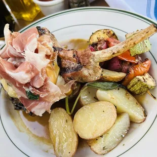 Lombatina Emiliana broiled pork chops and prosciutto in white wine sage