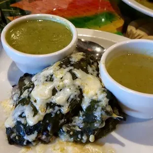Stuffed chile relleno poblano, very good, served with cream of poblano soup and green chile sauce