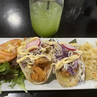 Fish and shrimp taco&apos;s with a cucumber drink.
