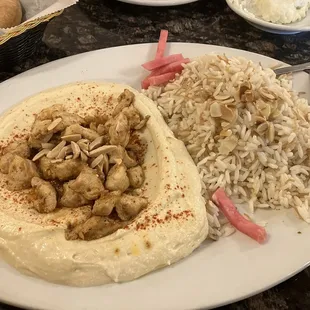 Hummus with chicken and almonds.