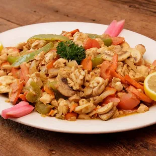 a plate of food on a wooden table