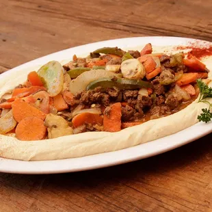 a plate of food on a wooden table