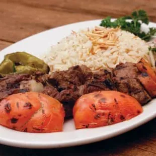 a plate of meat and vegetables