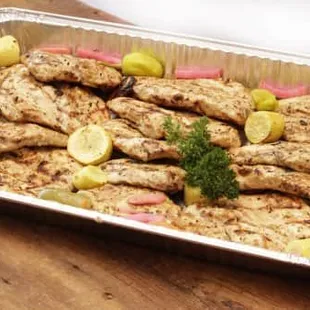 a pan of chicken and vegetables