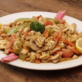 a plate of food on a wooden table