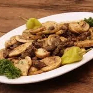 a plate of mushrooms and broccoli