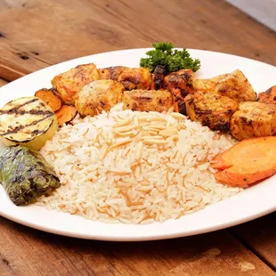 a plate of food on a wooden table