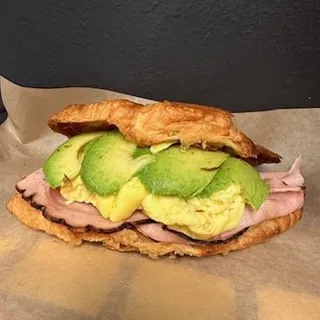Ham, egg, avocado croissant sandwich