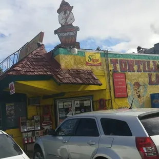cars parked in front of a restaurant