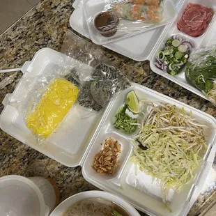 Raw beef pho with shrimp spring rolls