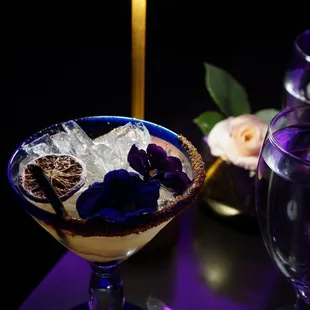 a glass of ice and a knife