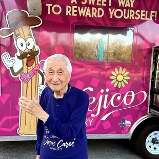 a woman holding up a sign