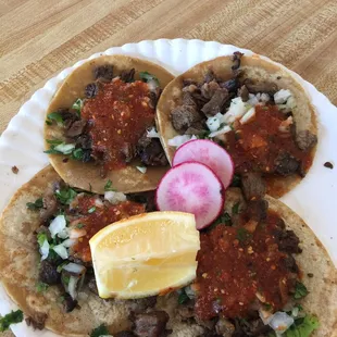 Tacos de Asada, with cilantro and chopped onion and a good sauce