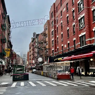 a city street with shops and people