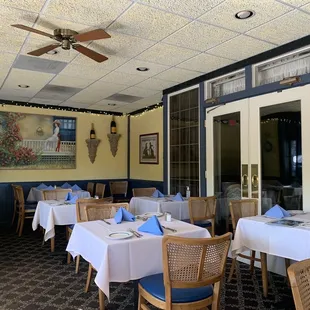 a dining room with tables and chairs