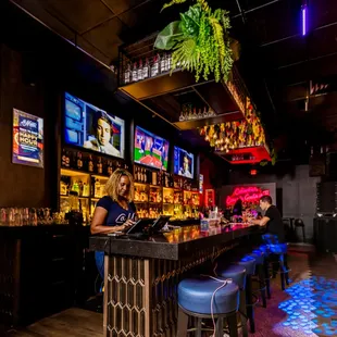 a woman sitting at a bar