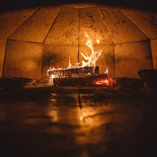 a fire in a brick oven
