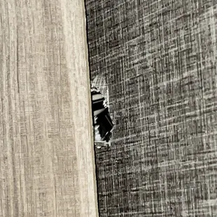 A hole in the ceiling which appeared after they fixed the roof membrane. The size of a quarter.