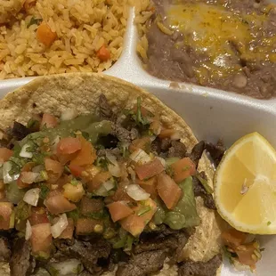 Carne asada taco with side of rice and beans