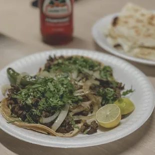 2 asada tacos with grilled onion!