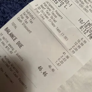 Receipt that shows hidden fees at the end.