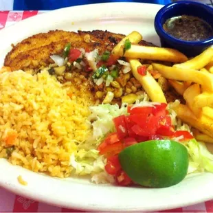 Tilapia served al mojo de ajo
