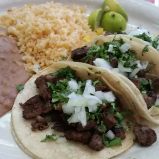 Carne asada tacos with rice and beans. Delish!
