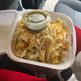 Bean and cheese and bacon three tacos are in there it is a container for a burger