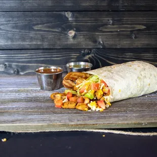 a burrito on a wooden table