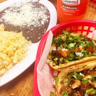 Rice, beans, steak and pork tacos