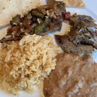 Steak Mexicana and carnitas. I learned about this restaurant from a friend when I was a kid, and they are still making delicious food.