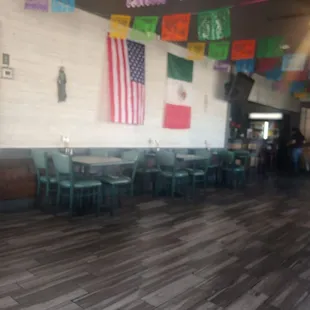 The left side of the restaurant is tables and most of the other side is booths.