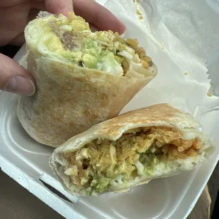 Avocado burrito with chicken.