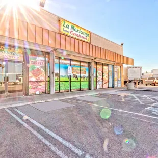 the sun shining over the store