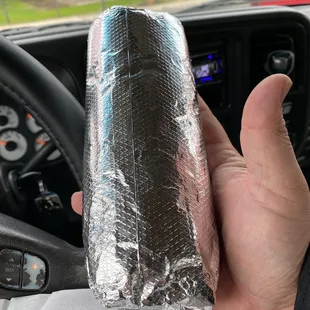 Super Chili Verde Burrito with the red hot sauce! Bigger than my haaand maaaan!