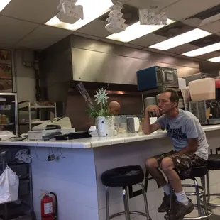 a man sitting at a counter