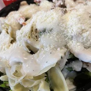 Shrimp Caesar salad with artichoke sundries tomatoes and mushrooms. Surprisingly my own combo and it was yum