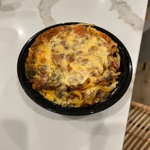 Bolognese with spaghetti kind of get smushed with the lid