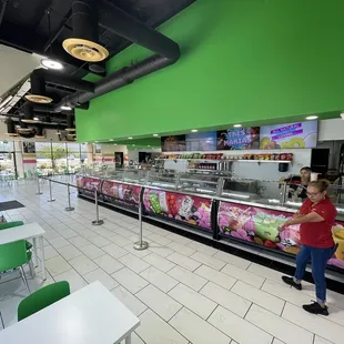 a woman standing in a cafeteria