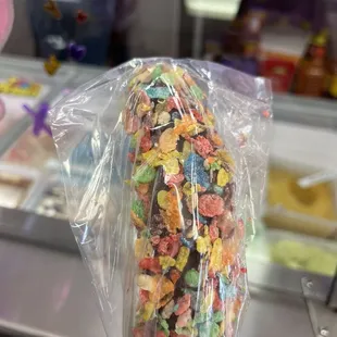 Fruity pebble covered chocolate frozen banana