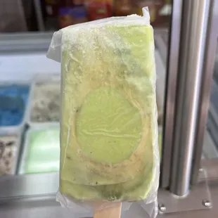  a close up of a piece of ice cream on a stick