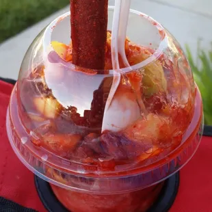  a plastic cup with a drink in it