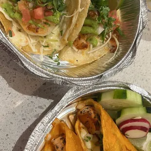 Shrimp tacos and salmon birria tacos (on right)