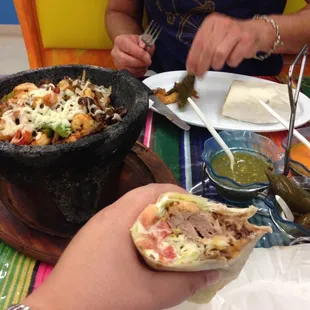 a person eating a burrito